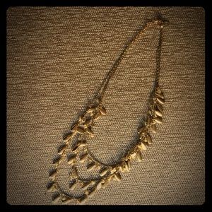 Gold three- tiered necklace